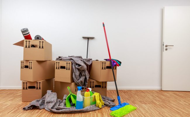 Clean,,White,Room,With,Cartons,And,Cleaning,Tools